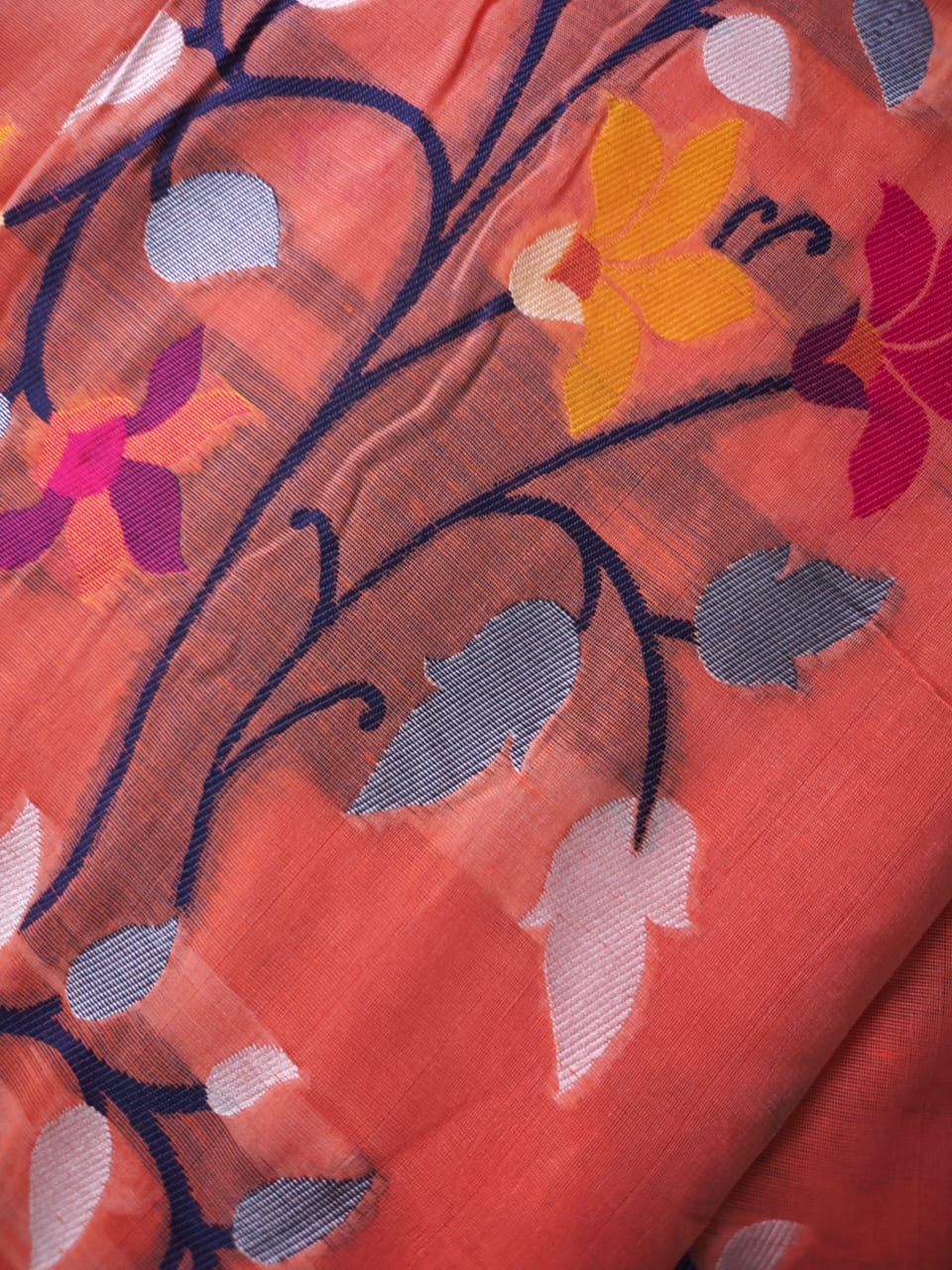Supplementary weft detail on peach Jamdani