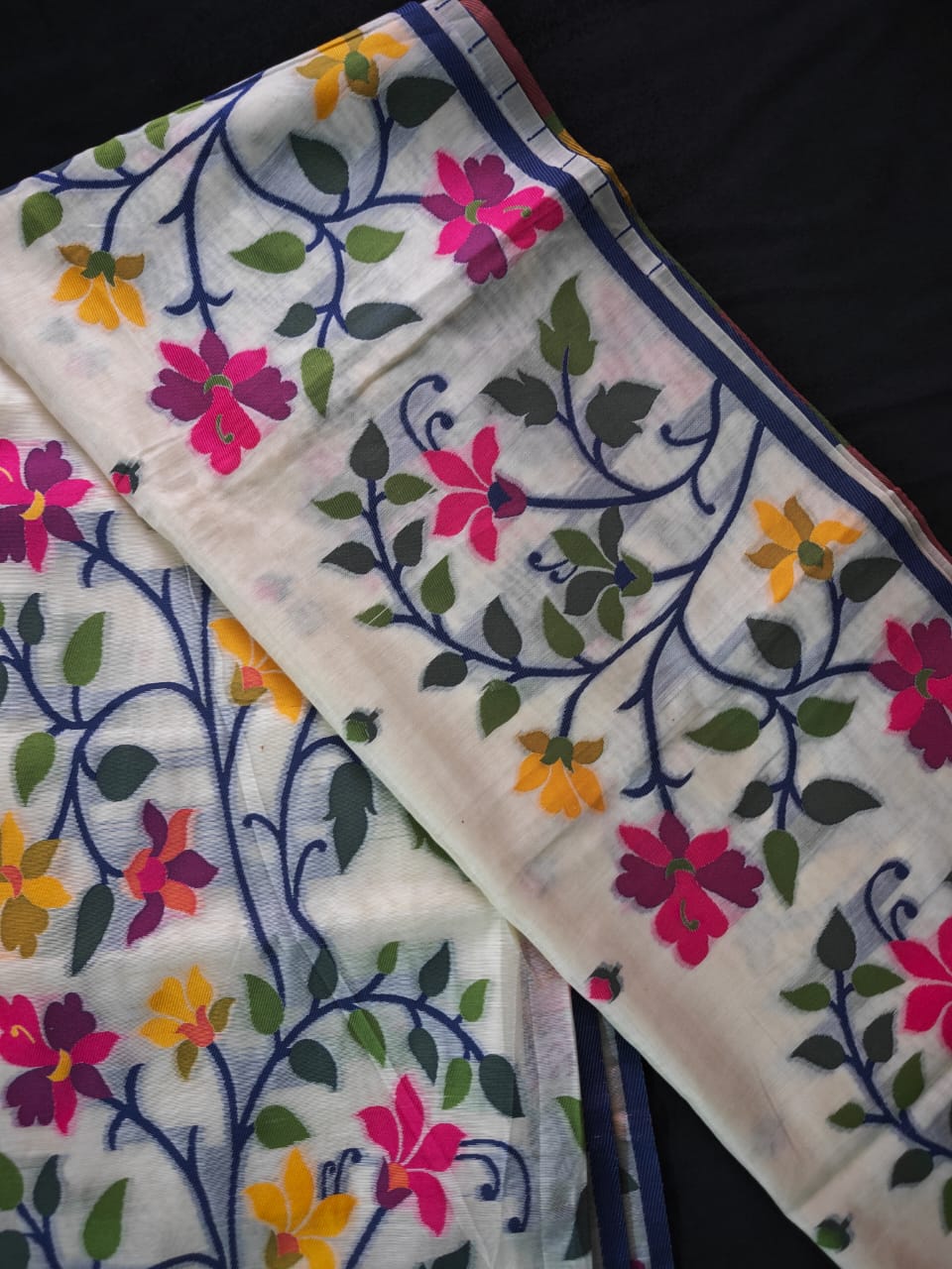 Supplementary weft detail on white Jamdani